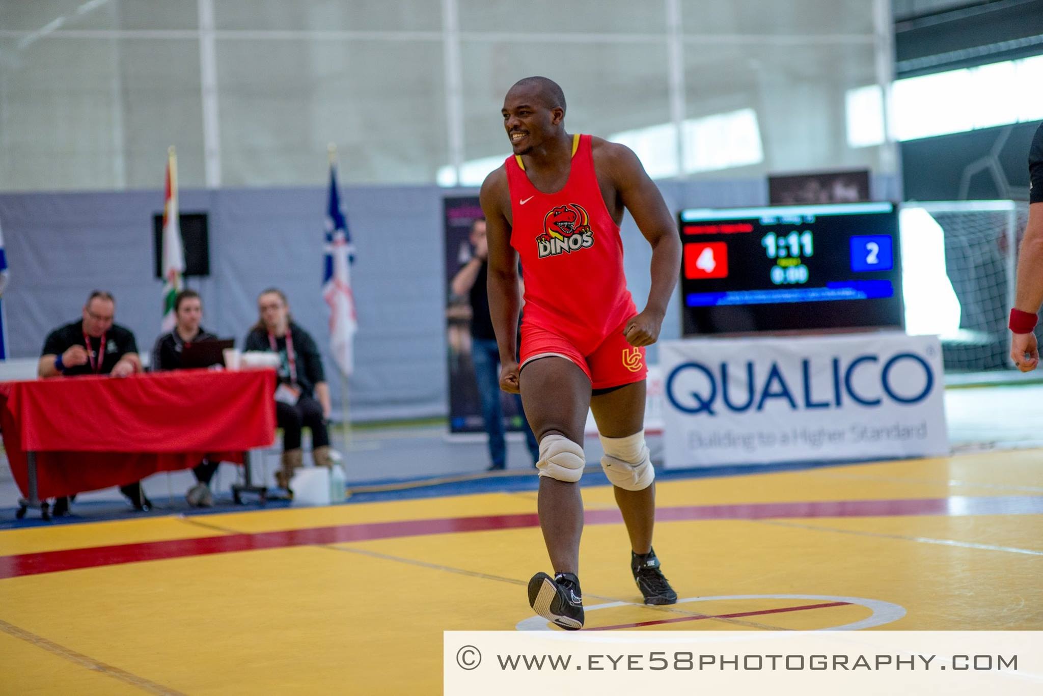 Baldwin Asala on the mat during a University of Calgary Dinos wrestling match