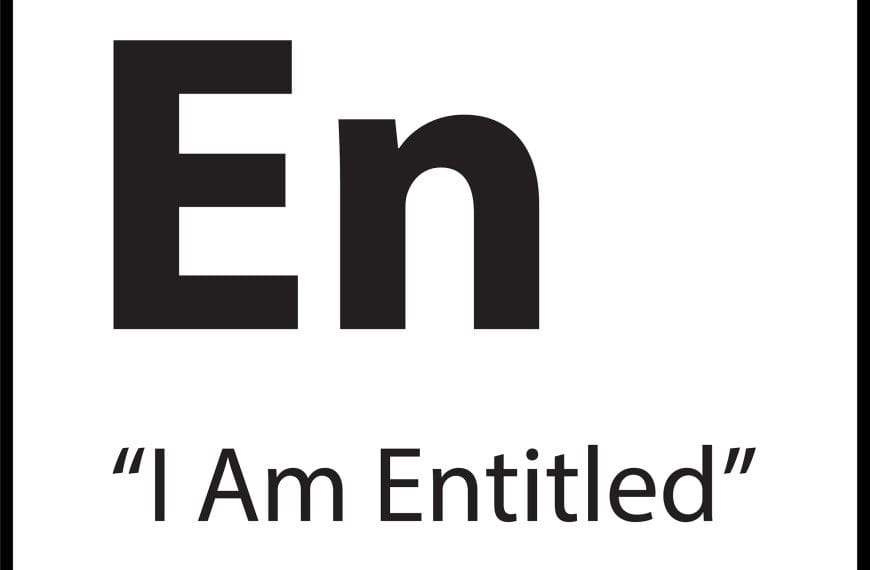 Black and white tile with the elemental symbol “En” and the belief label “I Am Entitled” — part of ShiftGrit’s 77 core belief system.