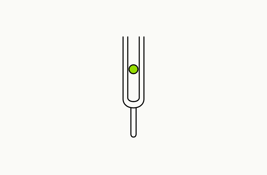 Isometric line drawing of an upright tuning fork with a brand-green dot suspended between its tines, the glossary specimen for the Reconditioning Protocol.